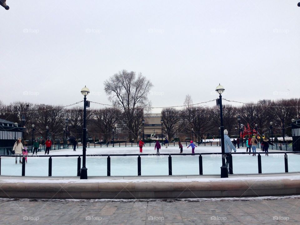 People ice skating in the city