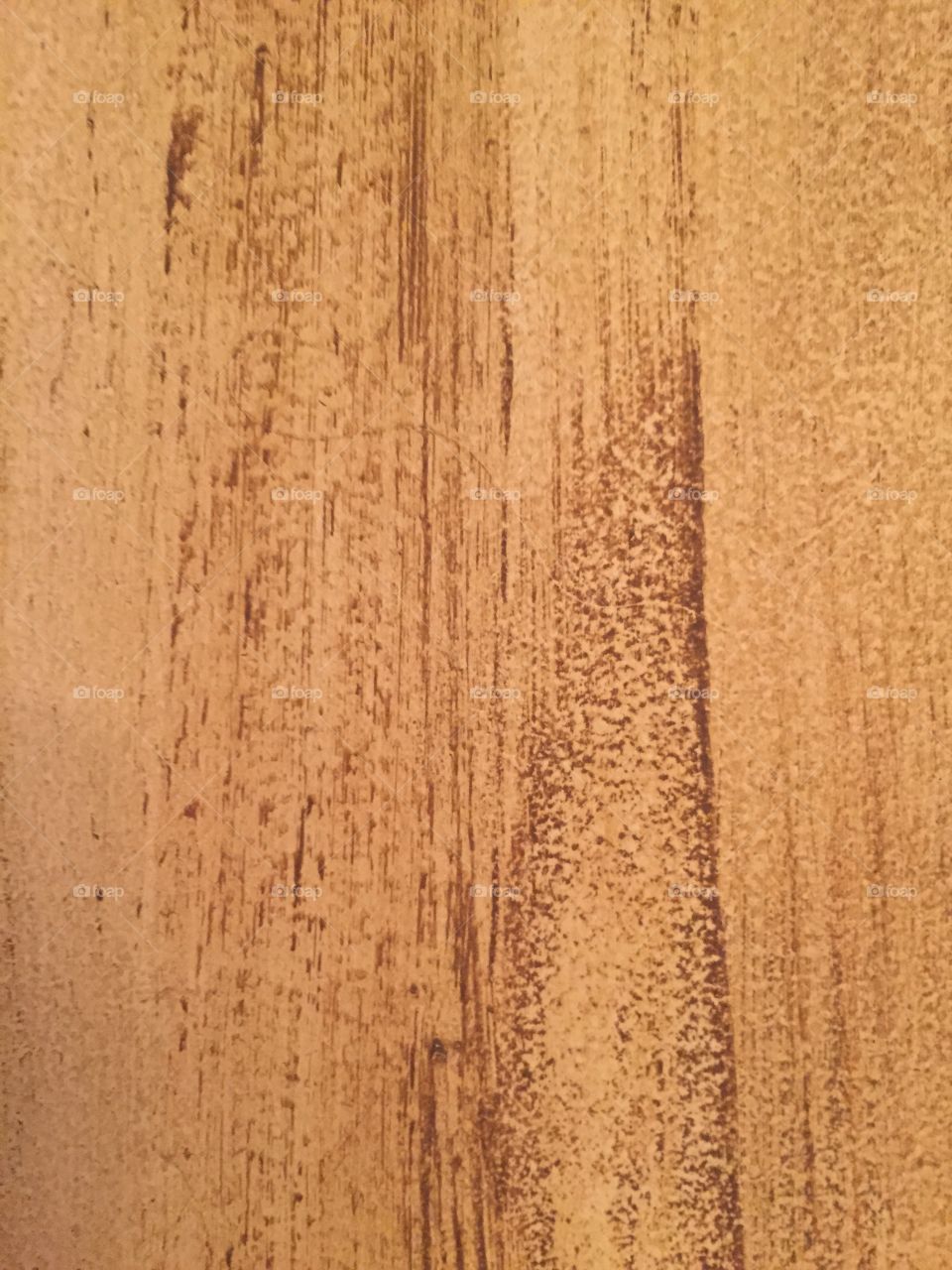 Brown painted door with a wood grain look in color brown showing texture.