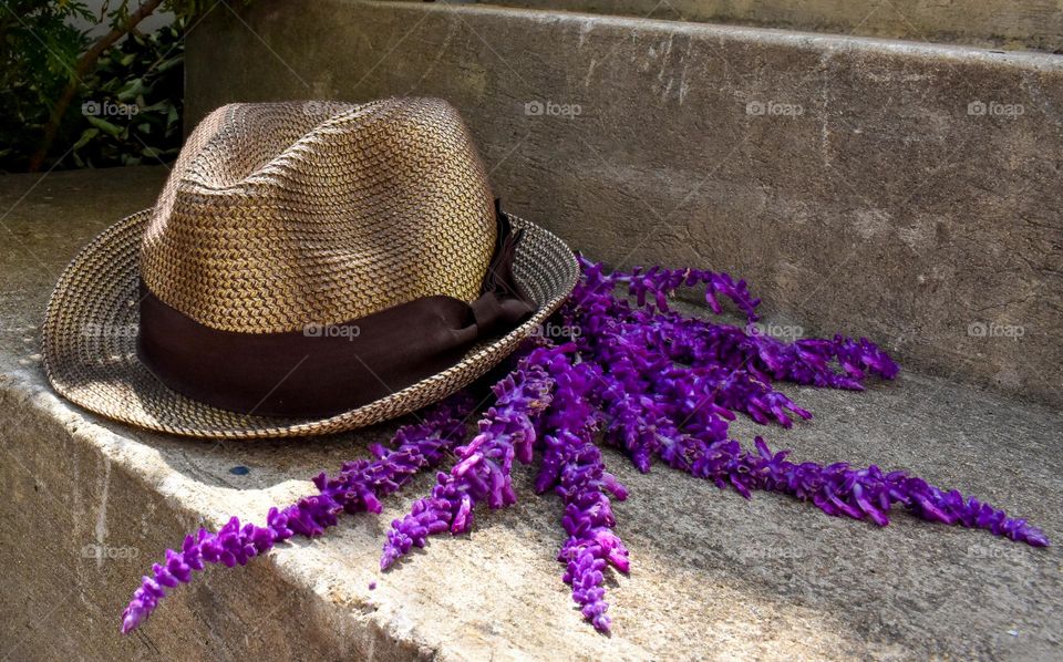 Pretty hat on stairs with pretty purple lavender flowers 