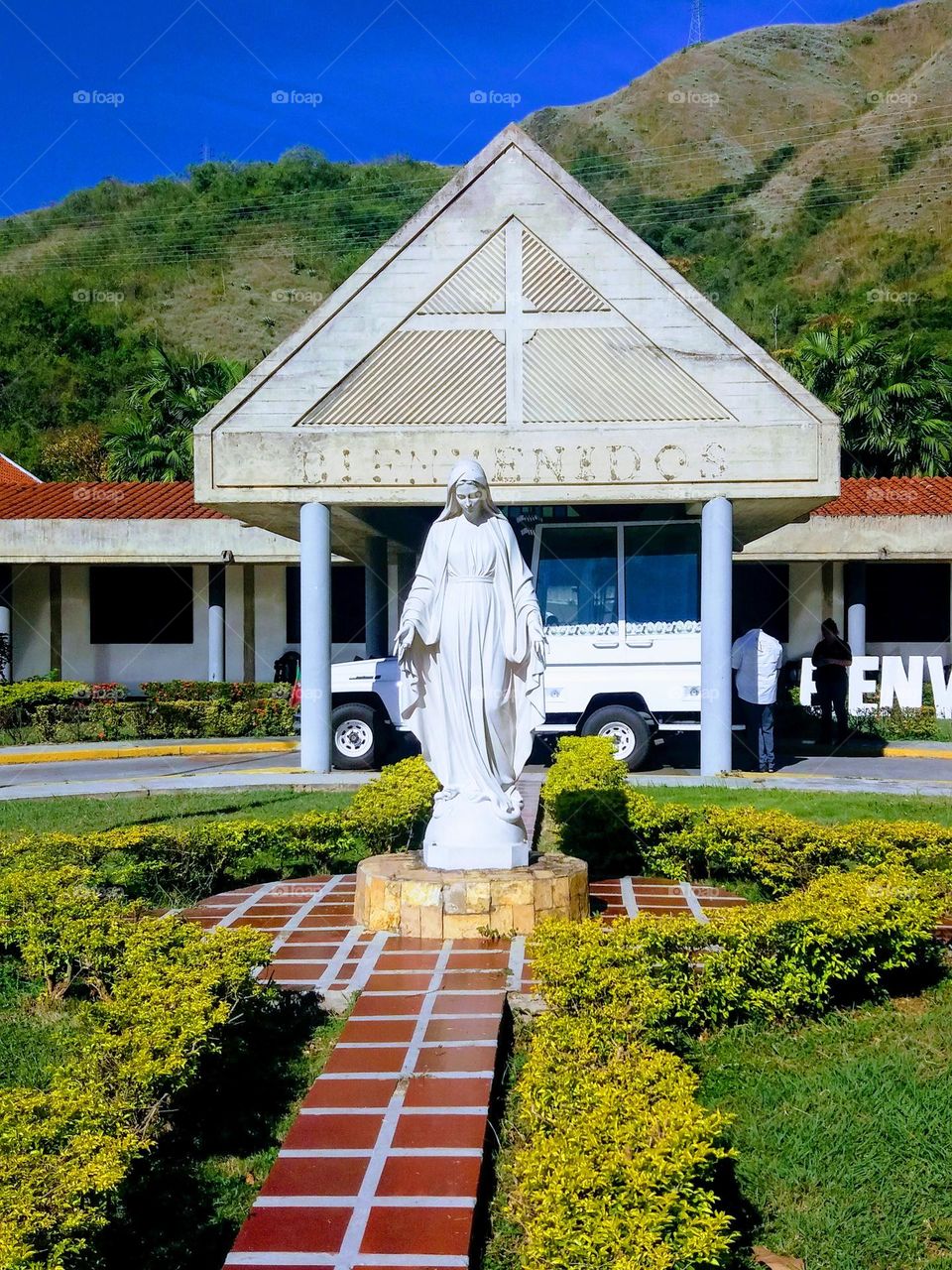 entrance to the church in the shape of a triangle with the beautiful Miraculous Virgin at the entrance