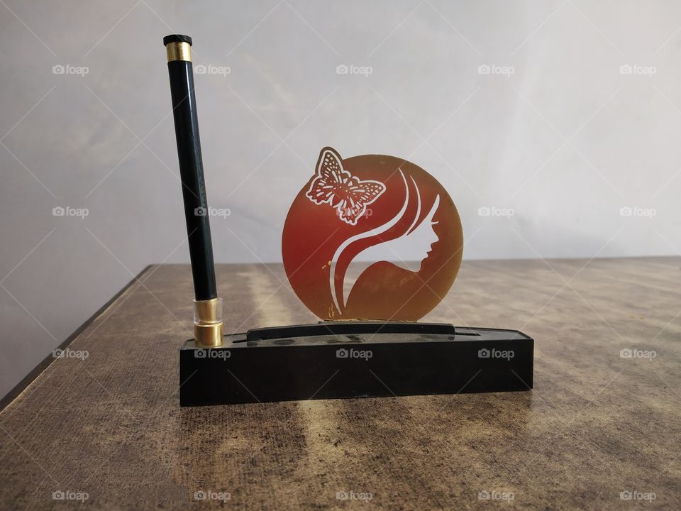 pen with abstract design stand