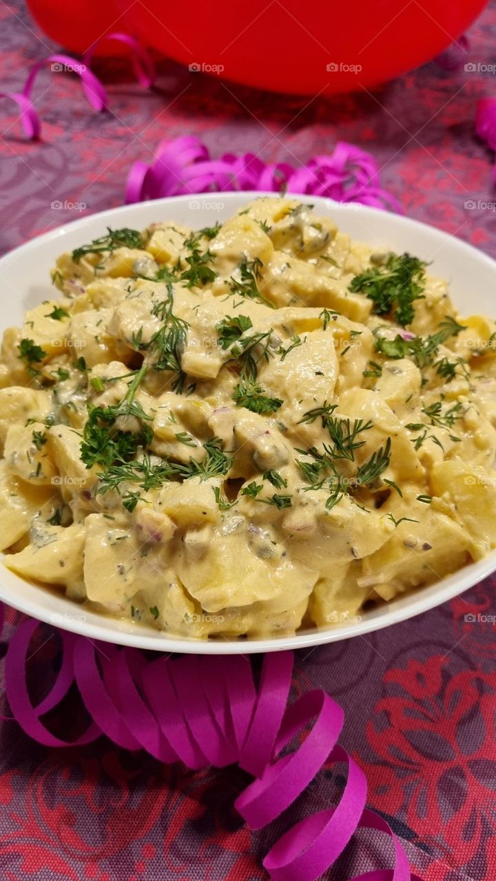 potato salad with sour cream mayonnaise, apple, caprise and onion