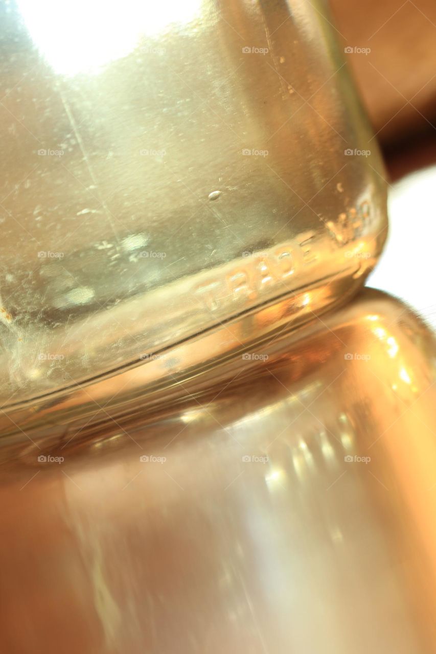 Mason jar on mirror with reflection 