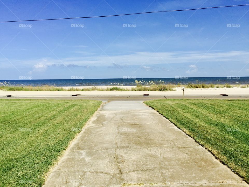My view from our place in Waveland, Mississippi looking down the drive towards the beach.