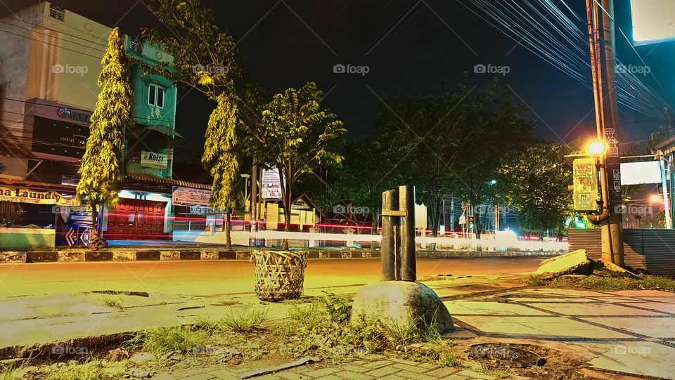 Defocused abstract background of city street at night with street lamp lighting. 
Blurred cityscape,Lighting night at tourist attraction colorful.