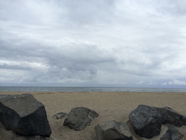 Winter Storm at Beach. Rocks at Sandy beach 