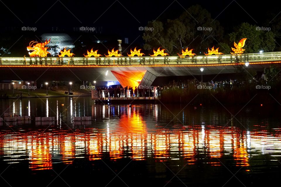 Chinese Dragon. Chinese  dragon on a illuminstrd bridge over the river torrens with lights reflections 