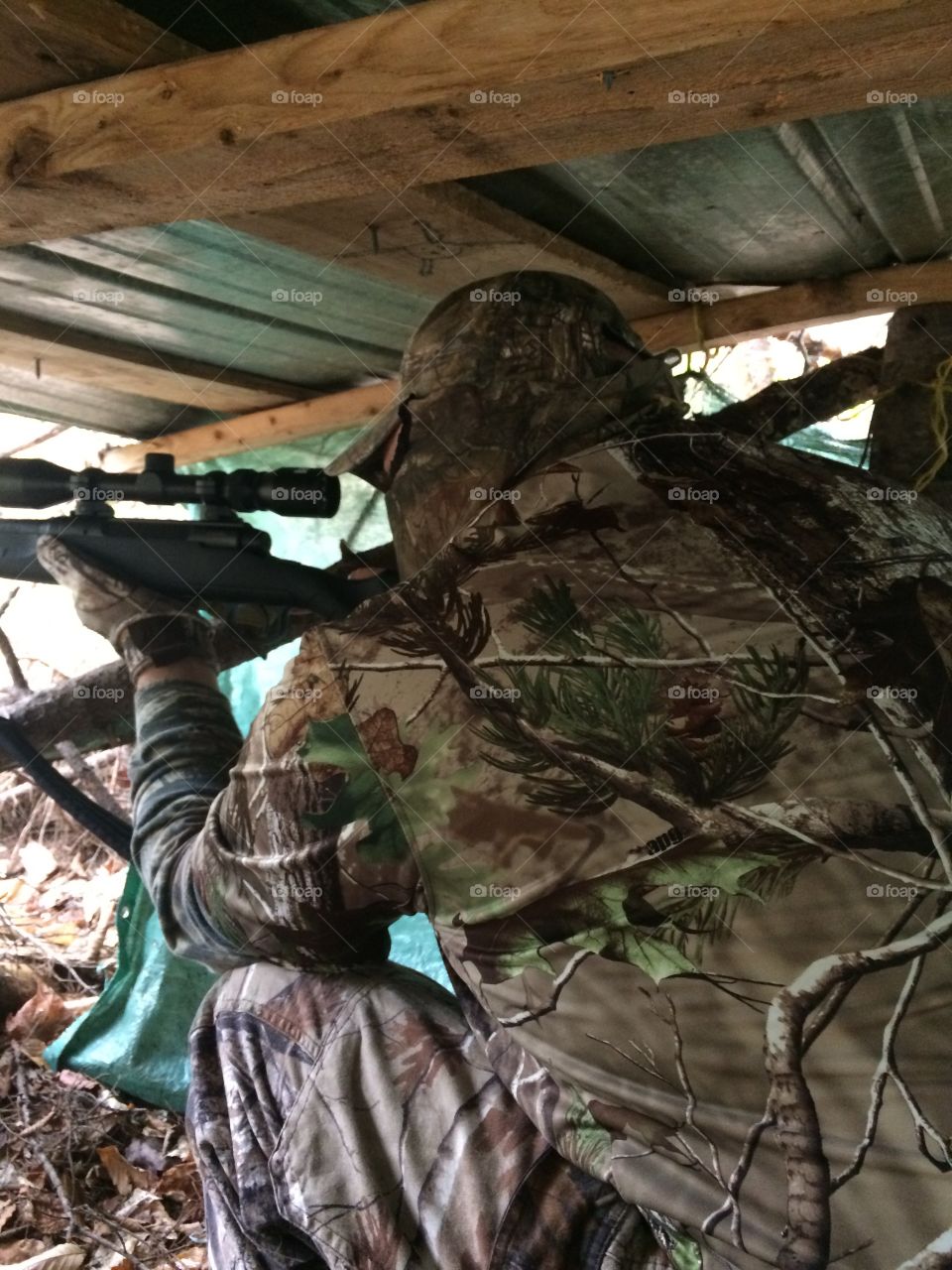 Lining up the scope on the 30-06 Savage Axis in a ground stand