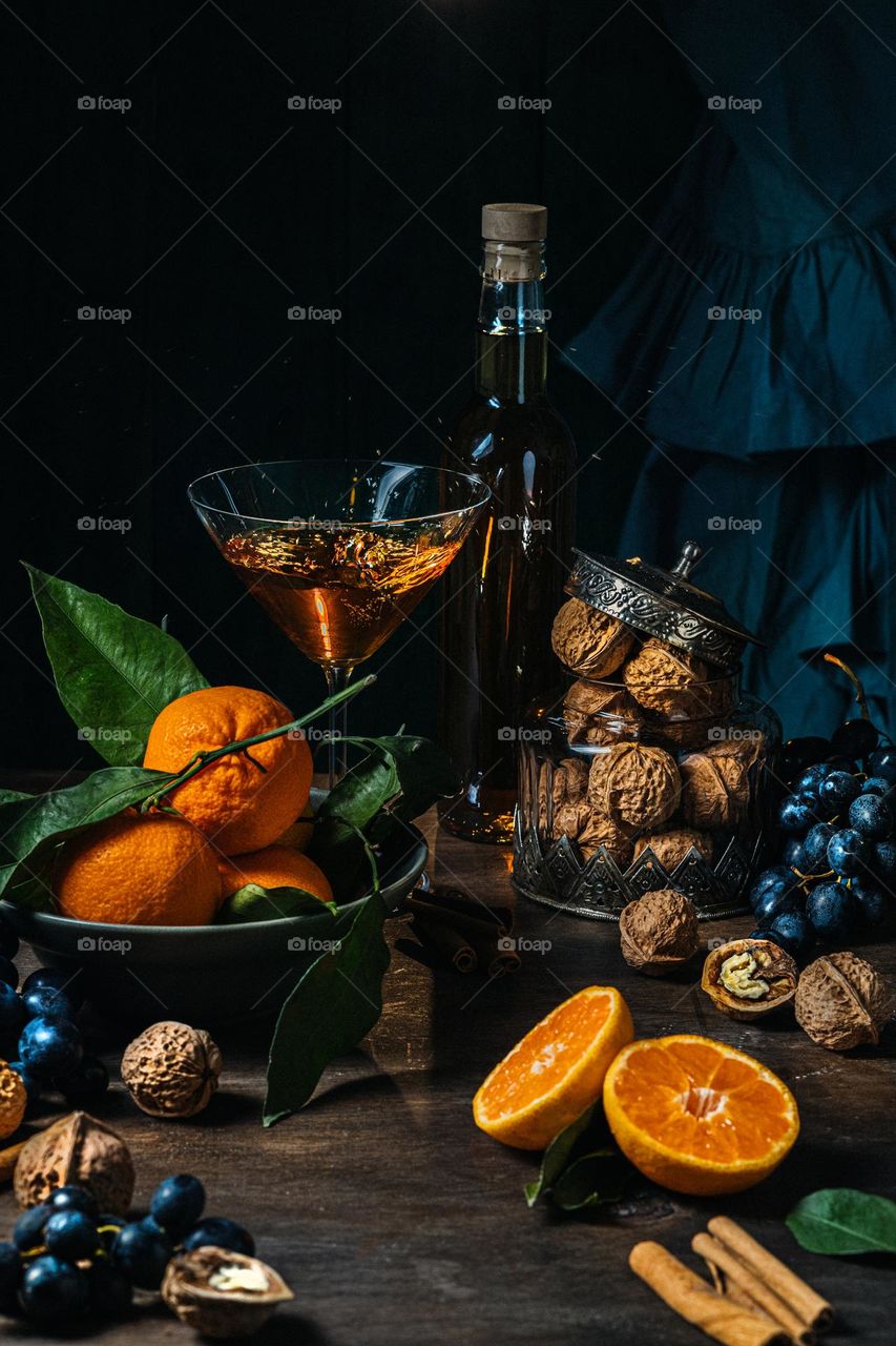 still life with tangerines, grapes and nuts