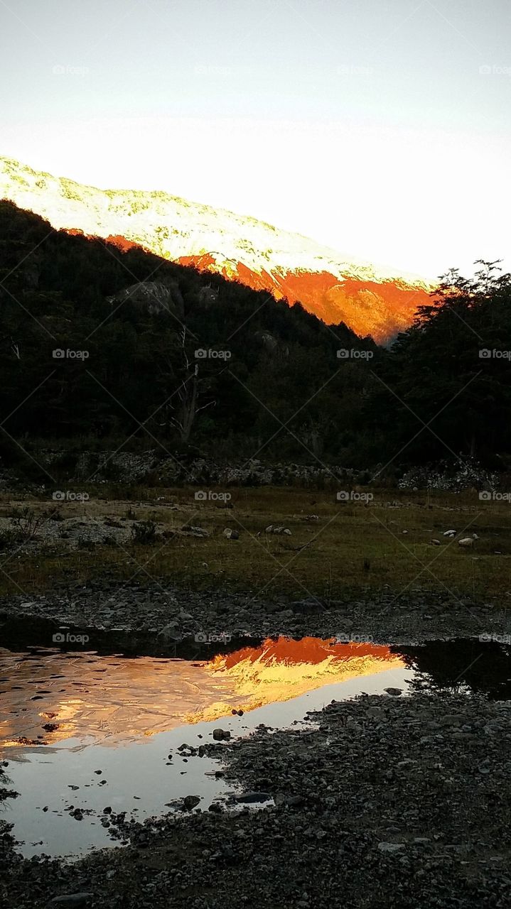 Reflection of mountain in water