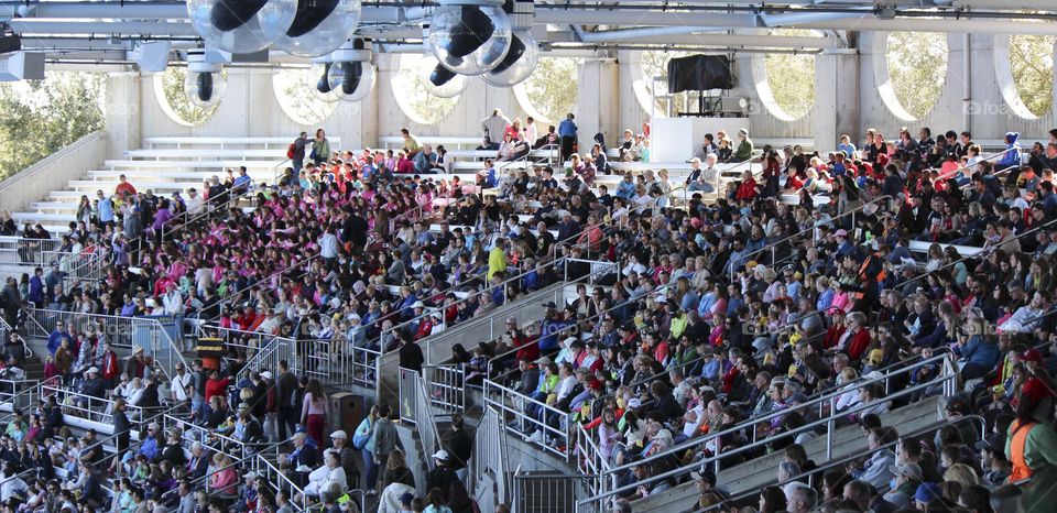 Big group of people watching a performance.