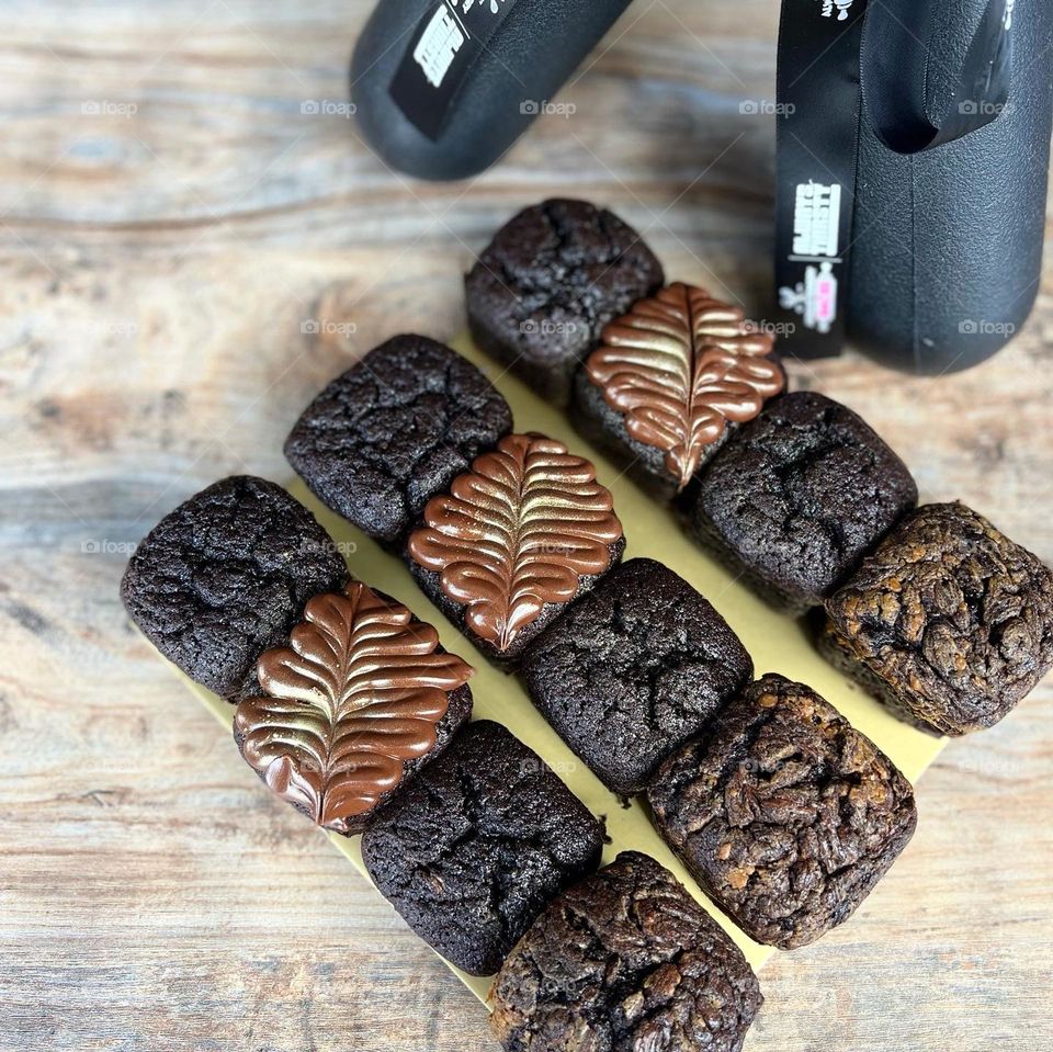 Dark homemade block brownies in different flavours  