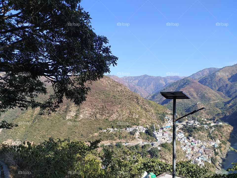 View of the rolling hills over the small town of Devprayag, Uttarakhand