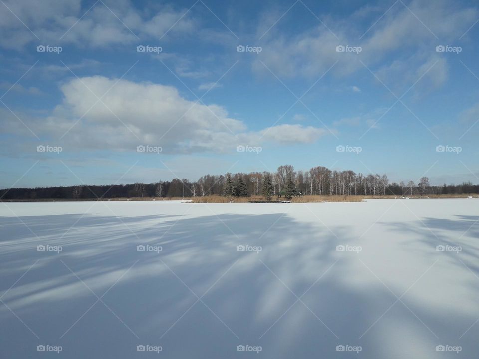 Shadows on frozen river