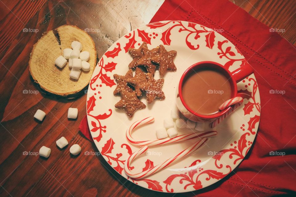 High angle view of coffee with candy cane and cookies