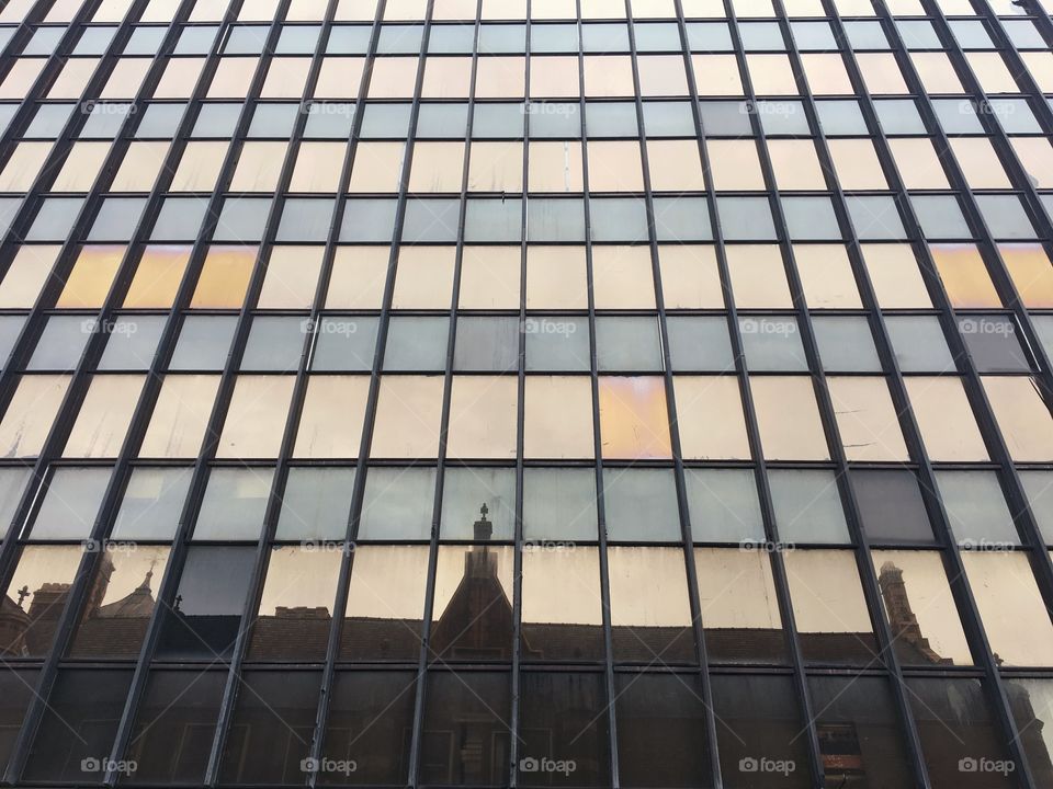 My Town ... looking up at some office buildings and noticing the church spurs reflection ...