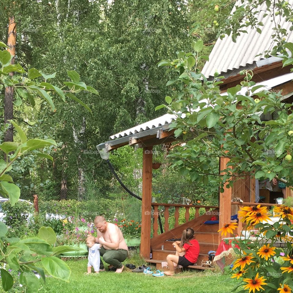 family resting in nature, it is the Siberian summer house.