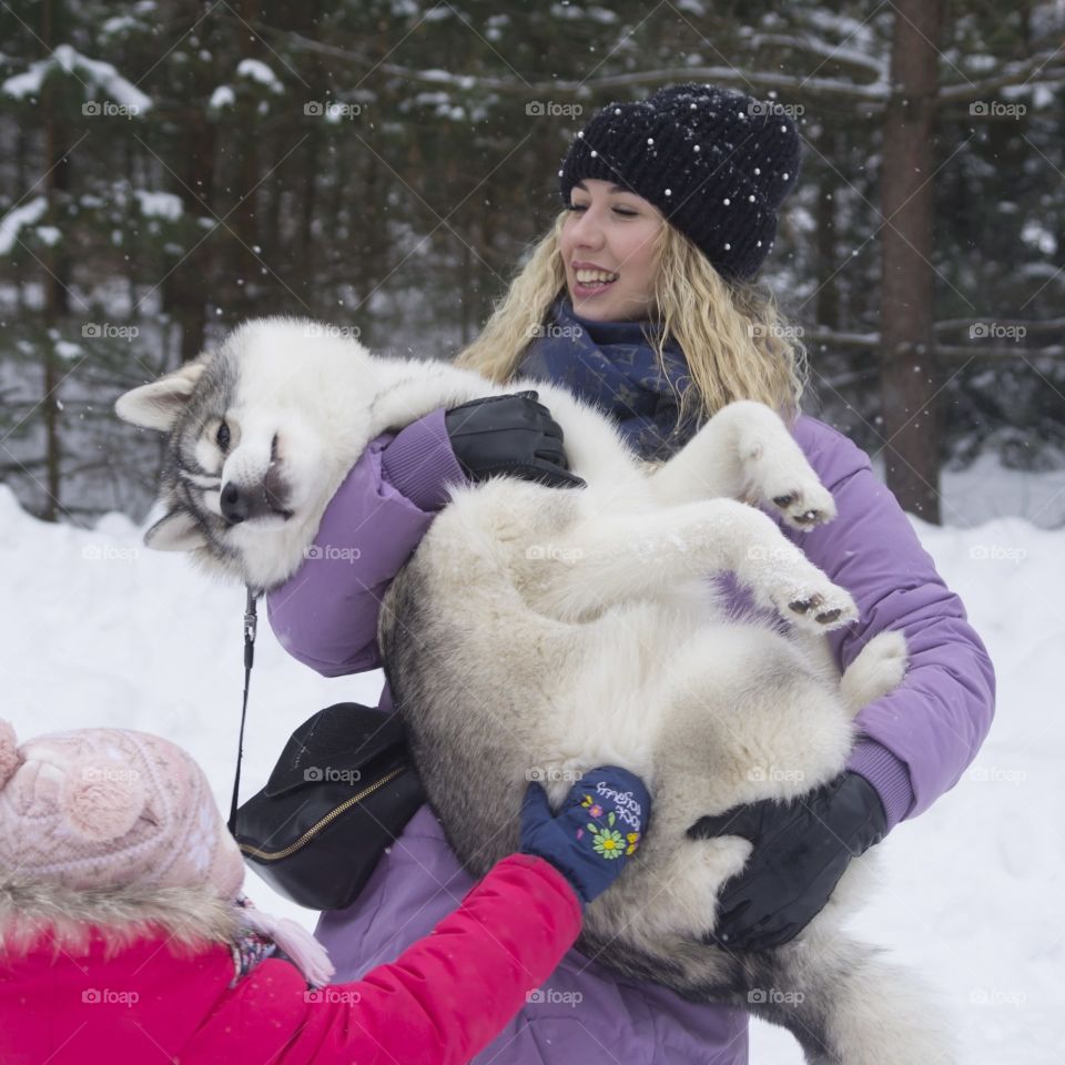 mother with daughter and dog husky