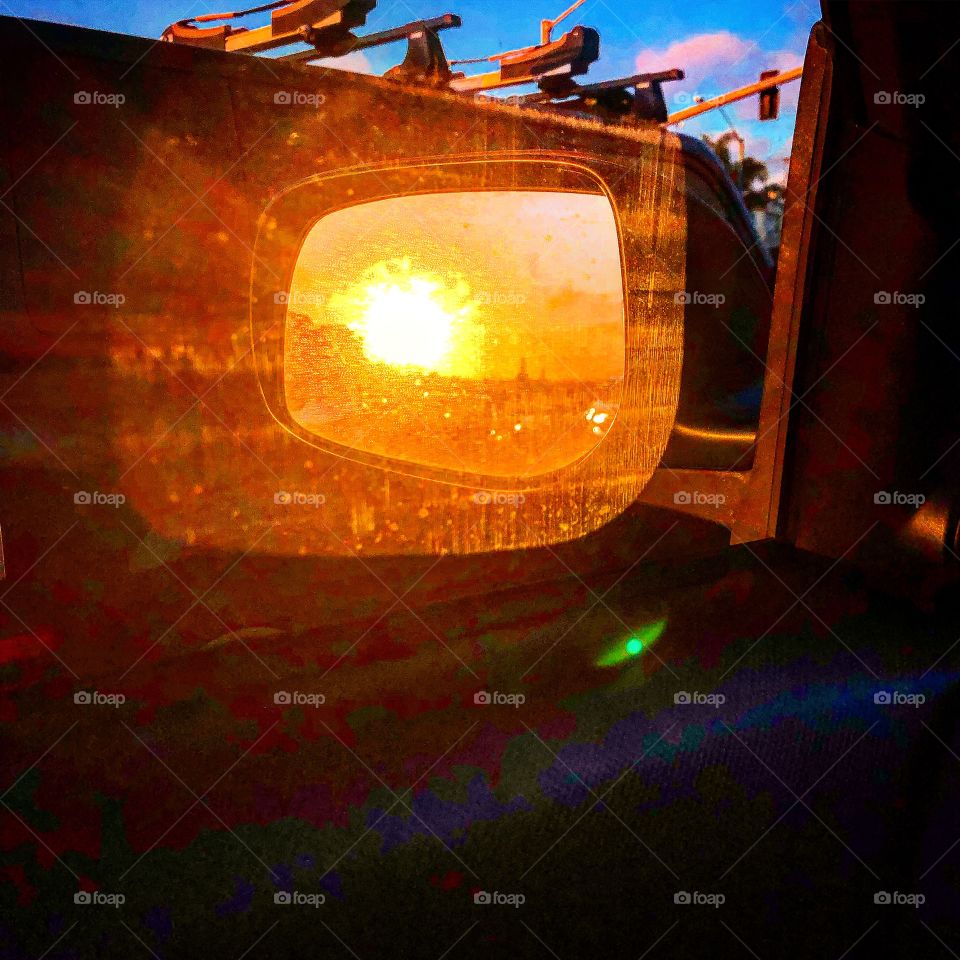 Sunset rear view mirror car 