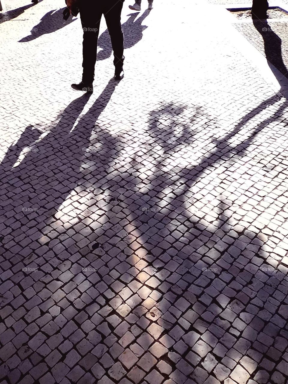 Shadow on the Portuguese pavement