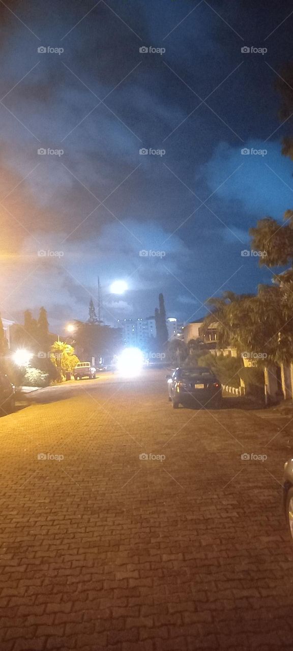 Full Moon with additional bright lights from car and street light
