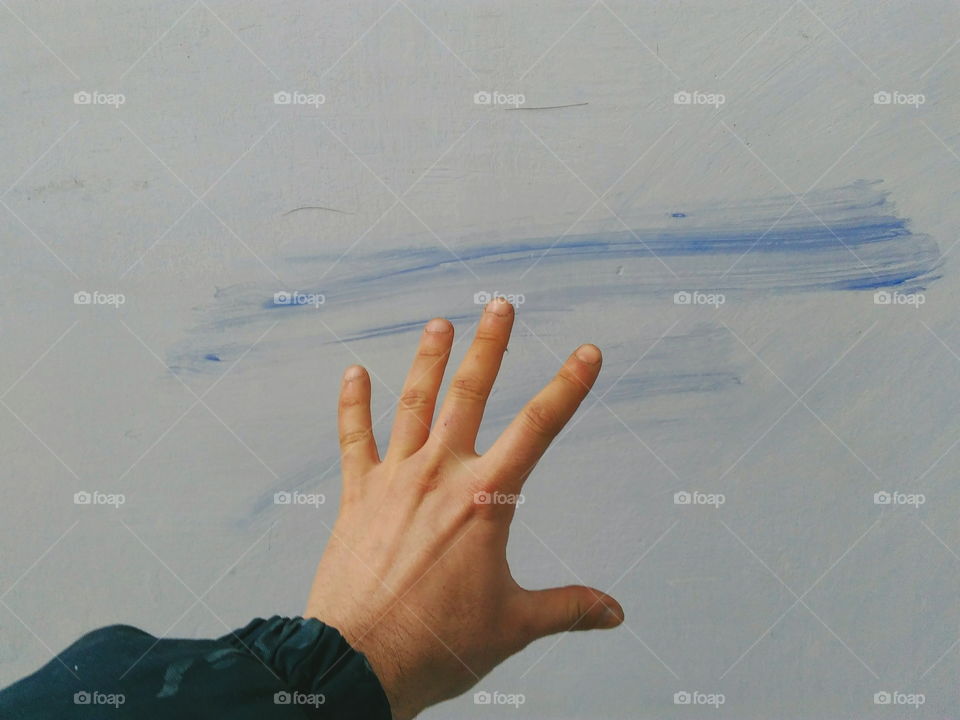 man's hand on a white background dirty wall