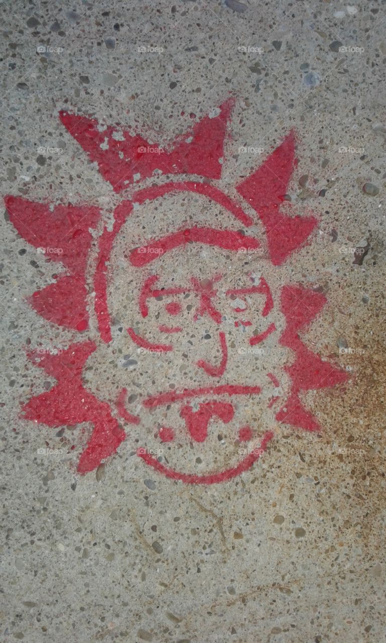 Rick from tv show Rick and Morty! Found this stenciled and painted on the pier!