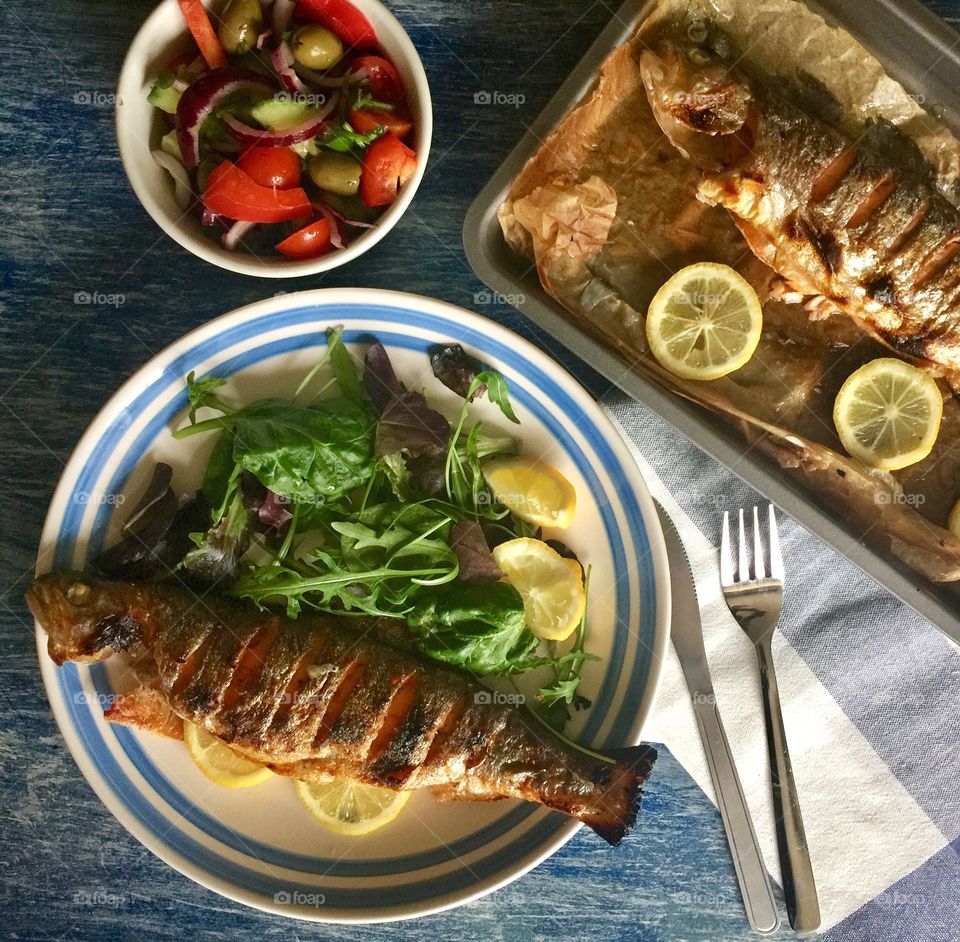 Grilled healthy fish in plate