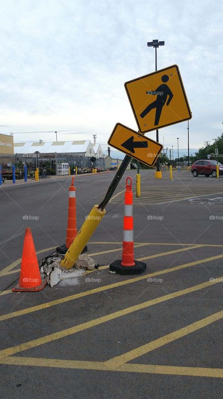 pedestrian crossing sign broken concrete