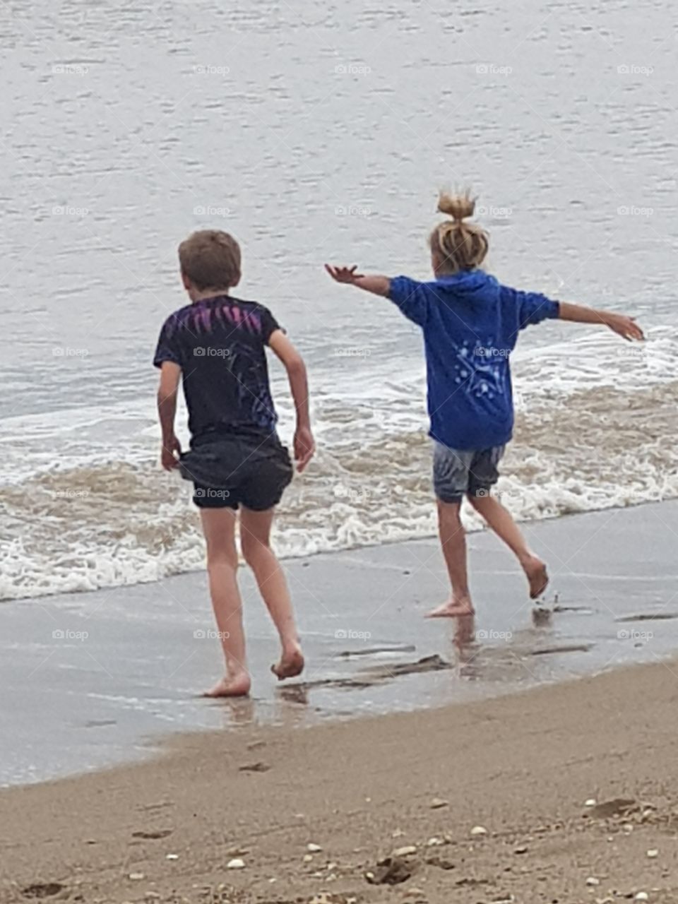 Here we go...two children running into the sea