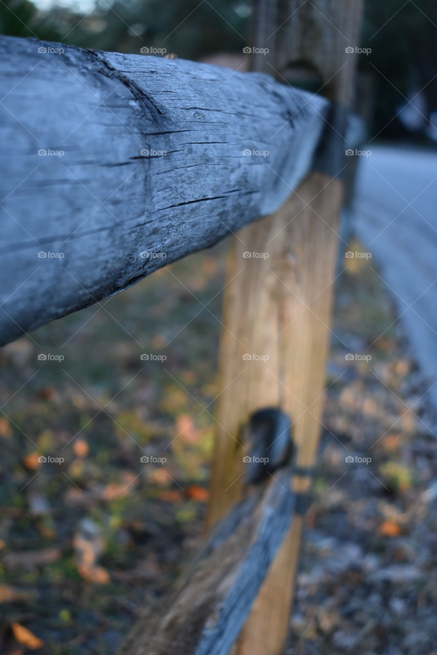 Wooden park fence in the fall
