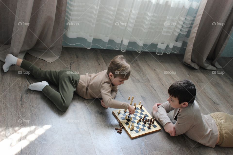 two boys playing chess