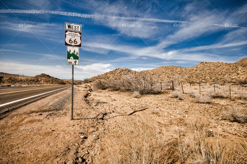 View of a road sign on desert road