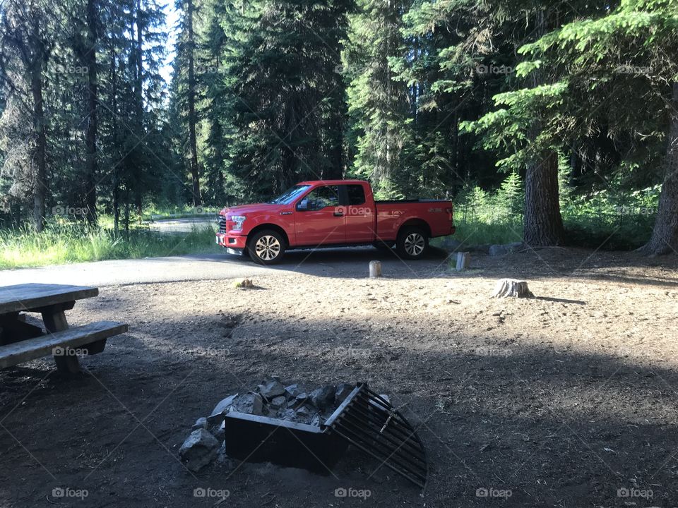 Bright red Ford F-150 ready to camp!