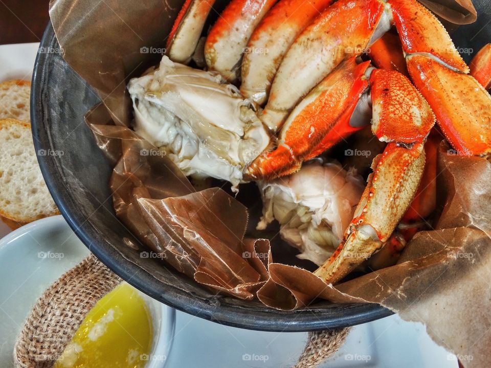 Steamed fresh Dungeness crab legs with butter