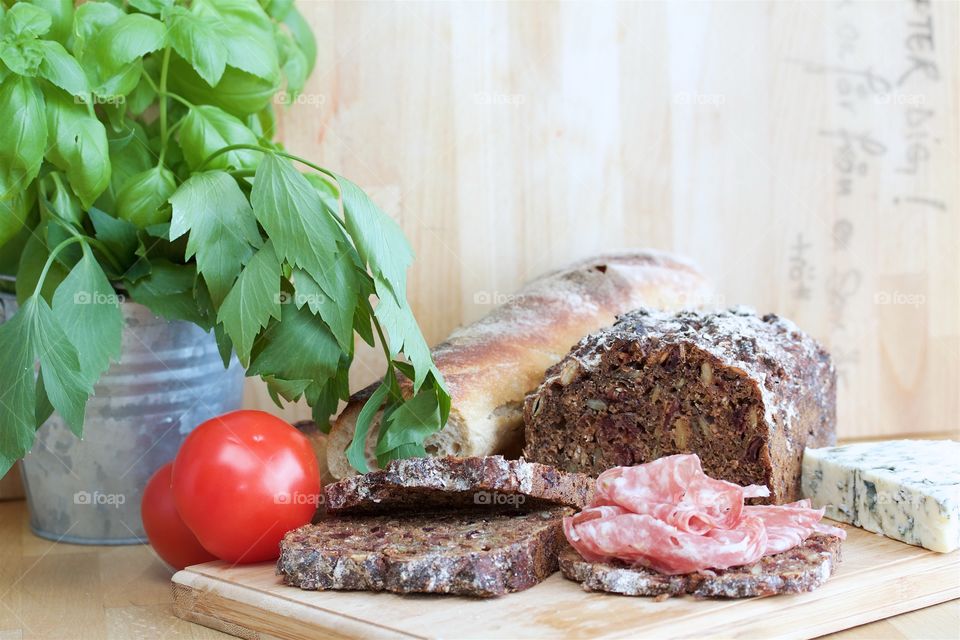 Food (bread, sausage, basil, lovage)