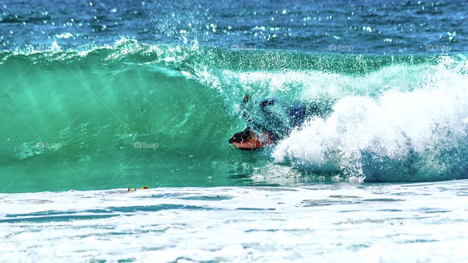 Looking for shade... This bodyboarder is deep in the tube looking for some shade during an Australian heatwave...