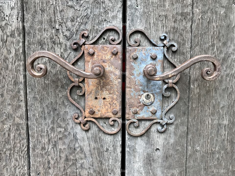 Perfect imperfections: ornate abandoned door handles 