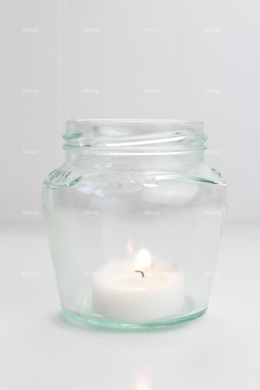 Candle in glass bottle