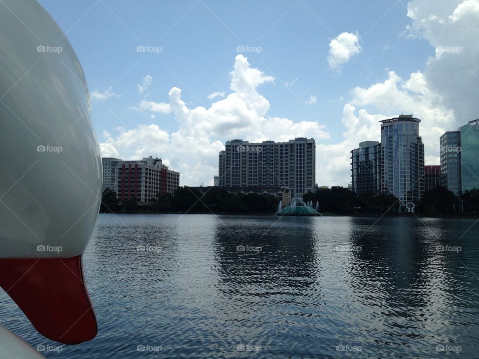 View of lake eola and downtown Orlando from swan paddle boat