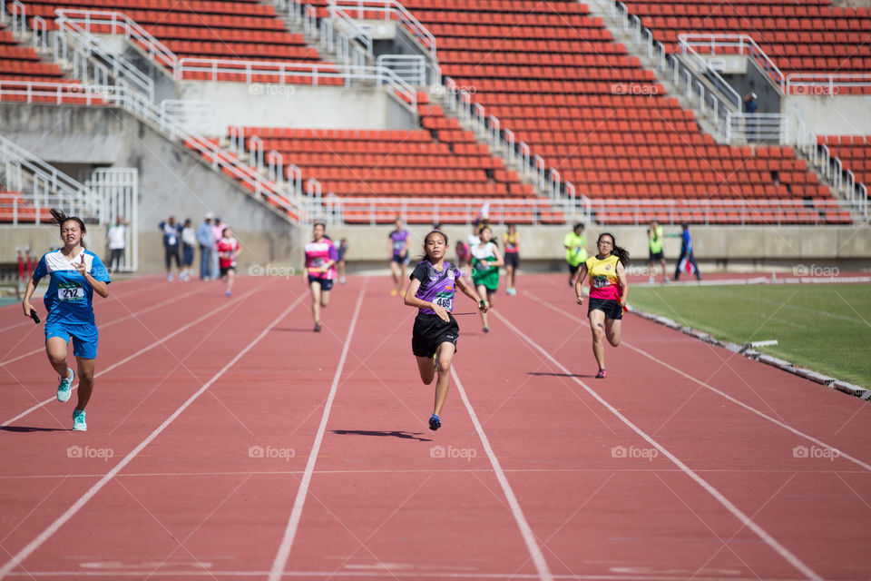 Athletic athlete running in track