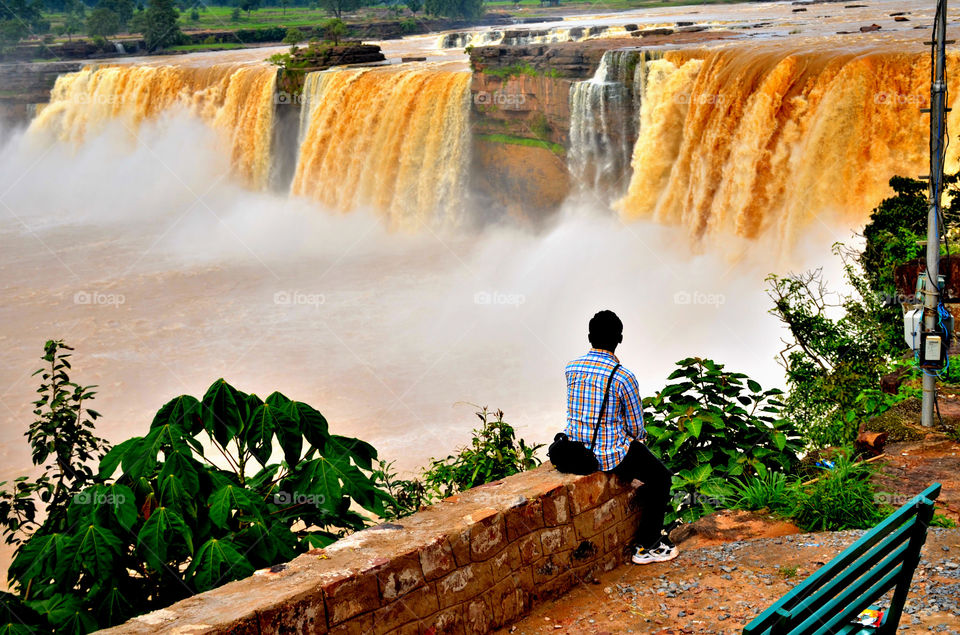 people enjoying waterfall