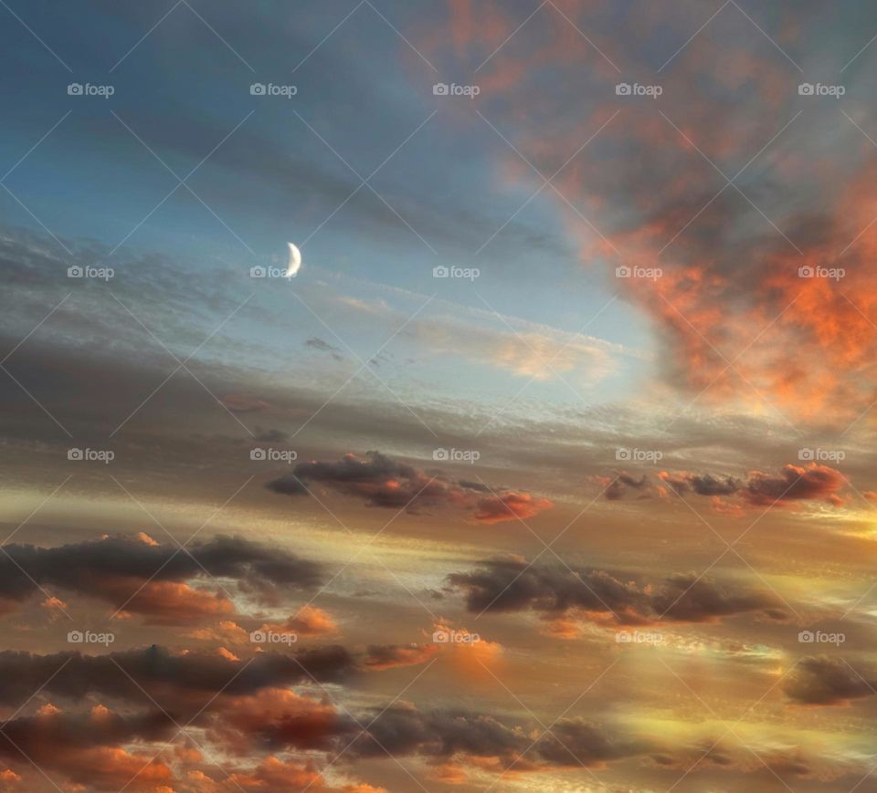 Cloudscape with a crescent moon 