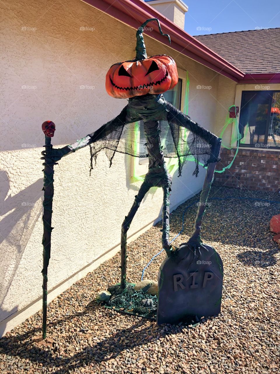 1/3 This tall pumpkin monster was actually created by my dad last year to decorate the front yard! (Daytime photo)