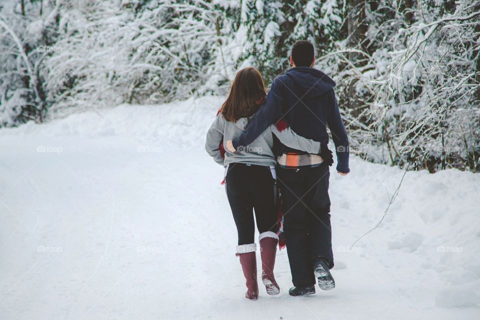 A couple walking together lovingly