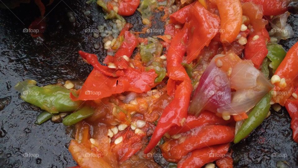 chili sauce is made from chili which is crushed so that the essence of chili comes out and other ingredients are added, such as salt and shrimp paste.