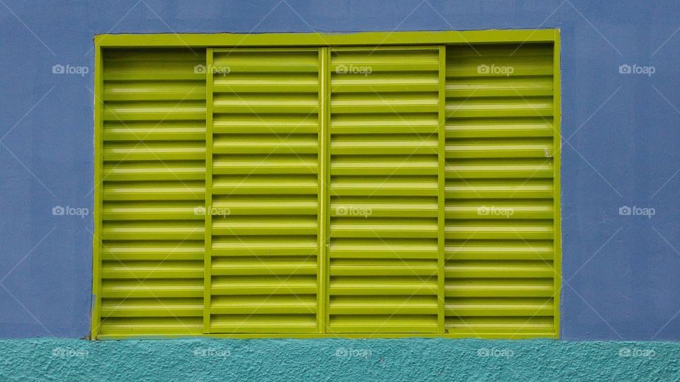 Close-up of green windows on wall