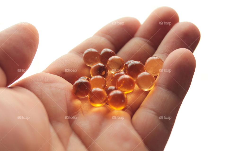 Pills, lights, ice, balls, hand, concrete, pills in hand, beautiful background, glass, round glass, glass balls, LEDs, capsules, bokeh,