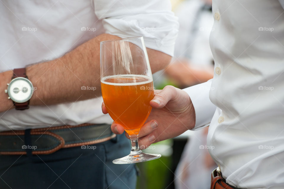 Men drinking beer at a wedding party in Sweden.