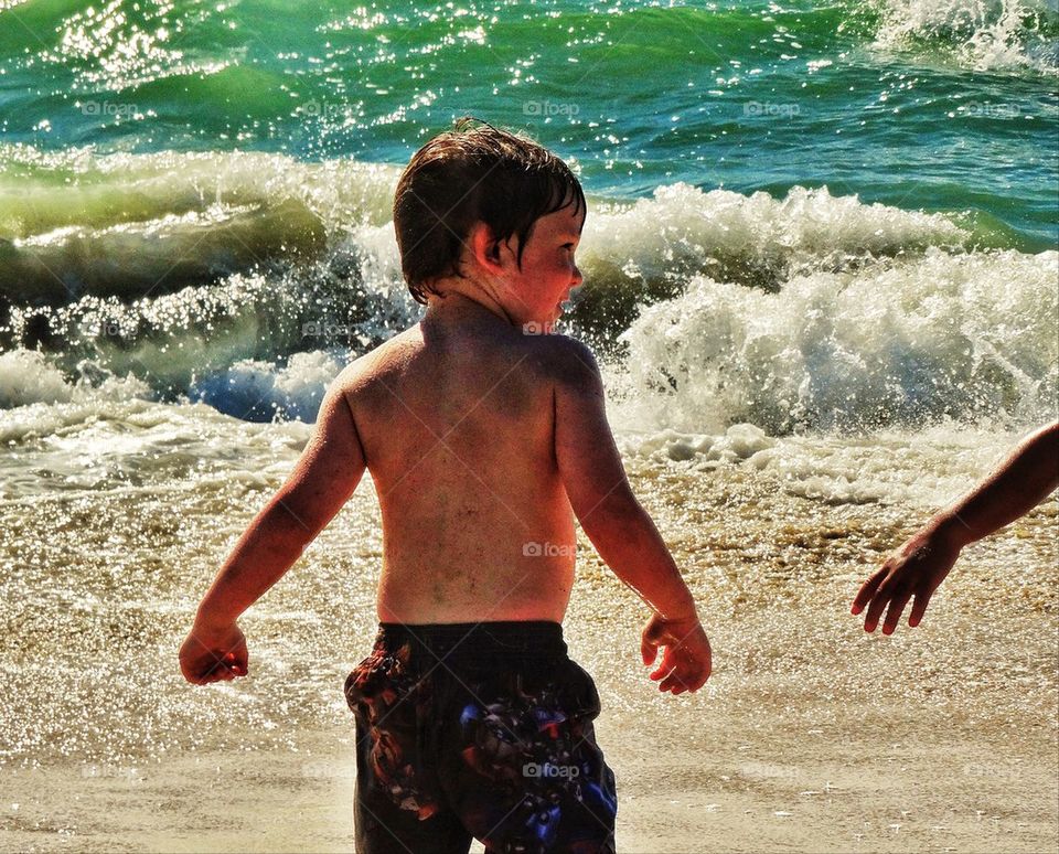 Two young friends on a beach